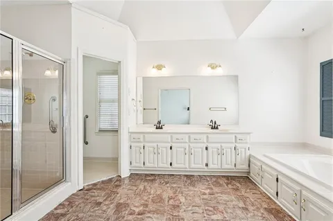 an empty room with fan and entryway