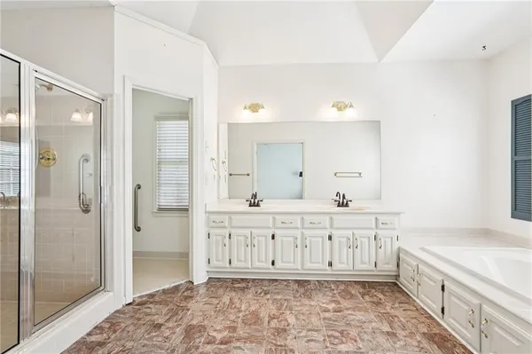an empty room with fan and entryway
