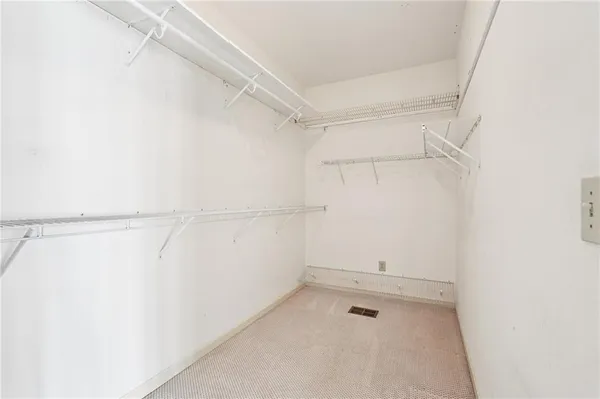 a room with pool table and windows