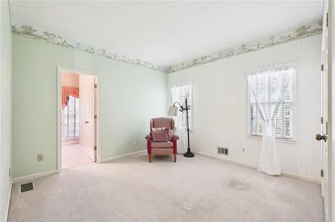 a view of a livingroom with furniture and a ceiling fan