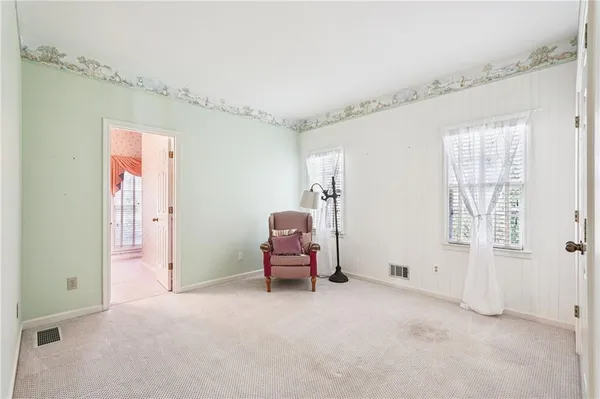 a view of a livingroom with furniture and a ceiling fan