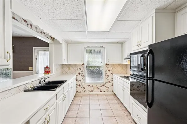 a view of a garden with plants and a lake view