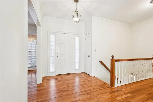 a dining room with furniture a fireplace and wooden floor