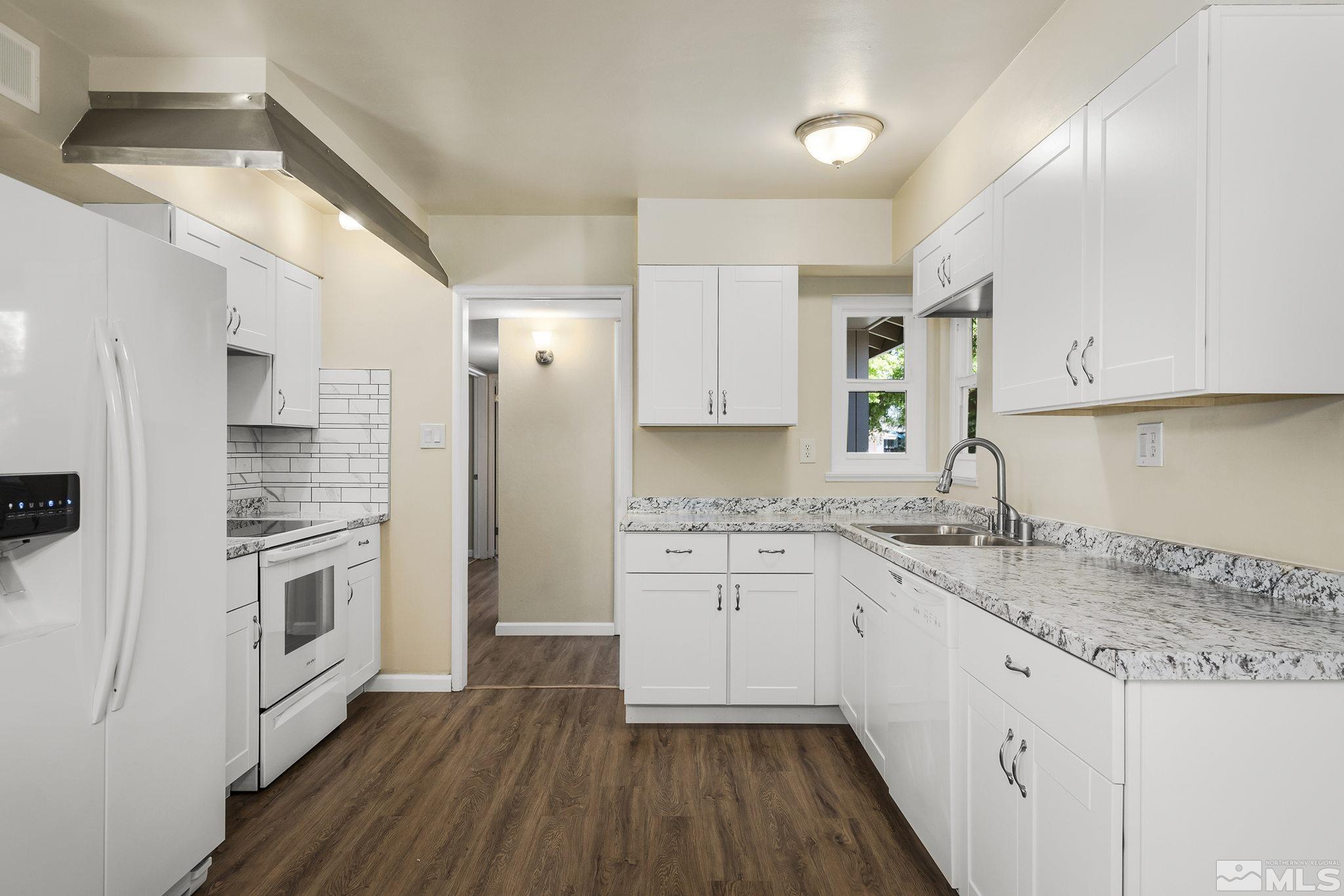 2050 Brisbane Avenue Reno, NV 89503 - Photo 3 of 24 a kitchen with granite countertop appliances cabinets and a sink