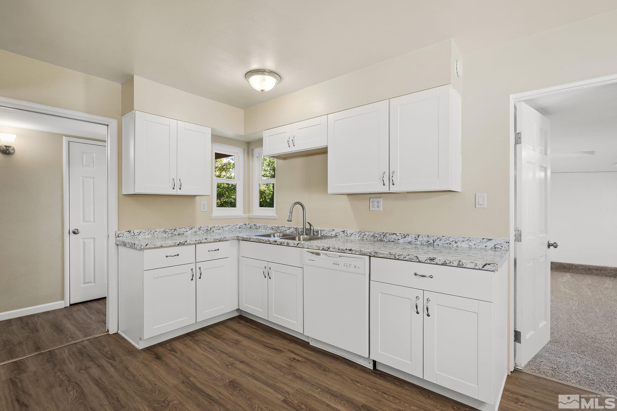 2050 Brisbane Avenue Reno, NV 89503 - Photo 5 of 24 a kitchen with granite countertop cabinets and white appliances