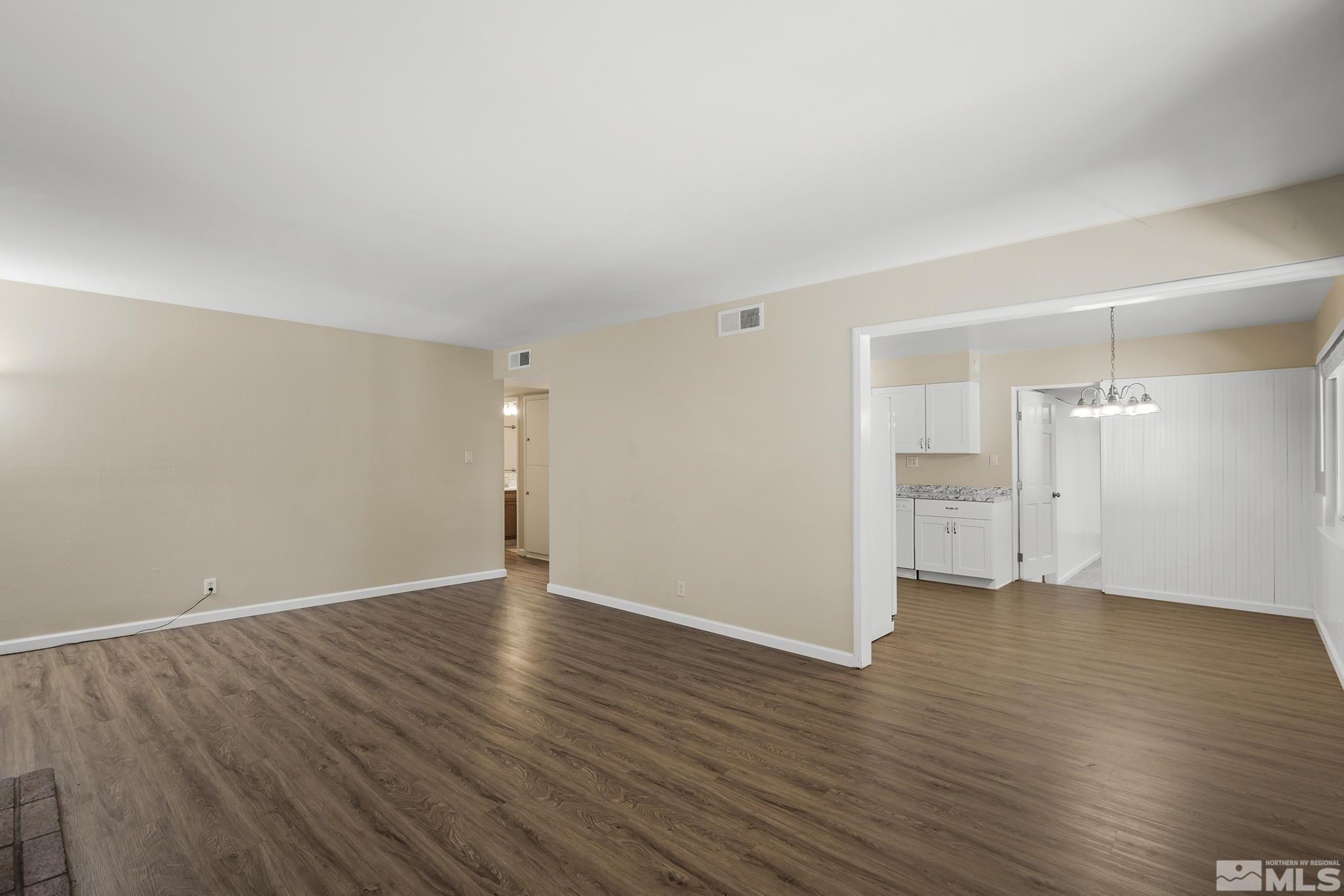 2050 Brisbane Avenue Reno, NV 89503 - Photo 7 of 24 a view of an empty room with wooden floor