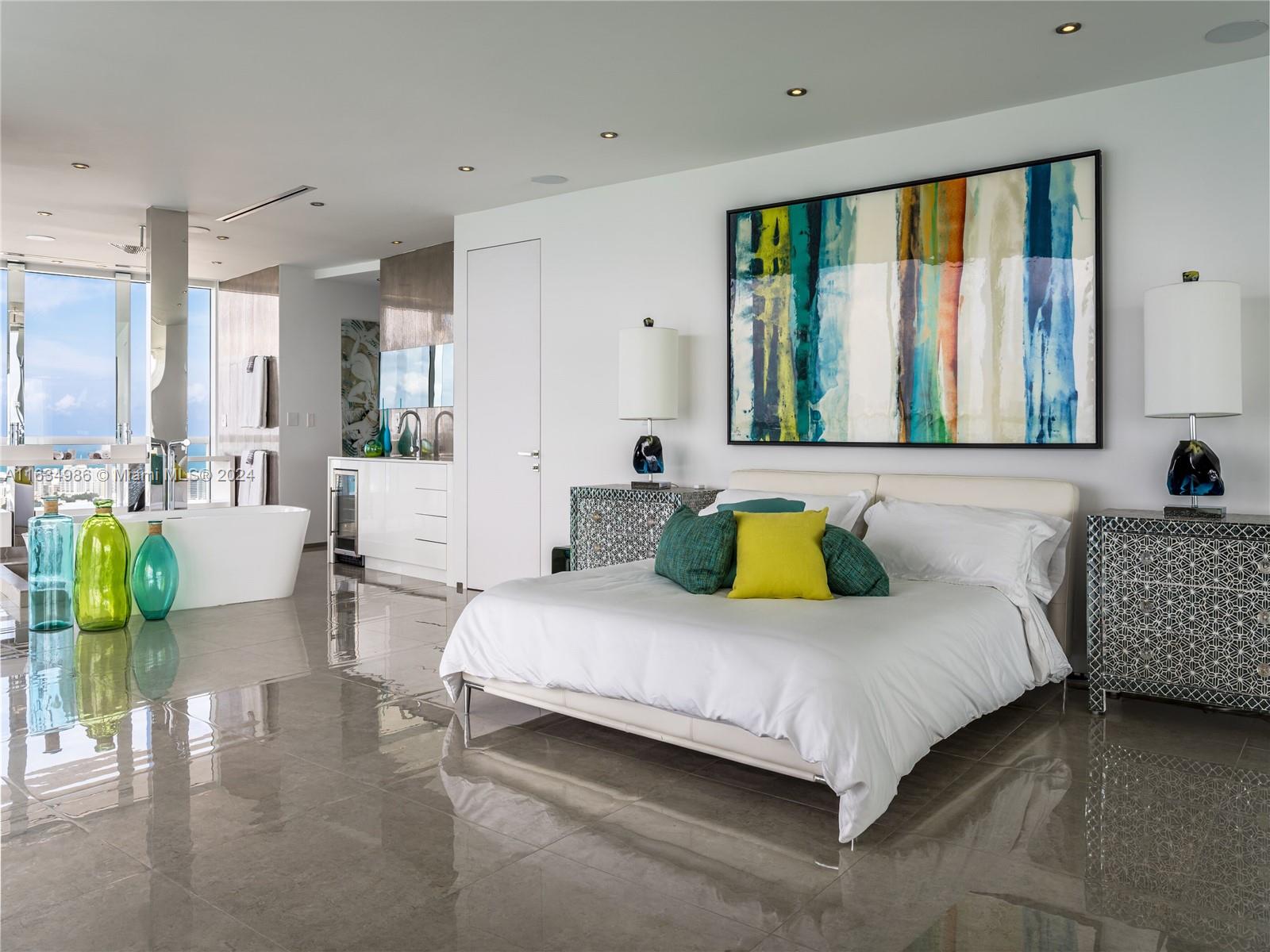 450 Alton Road, Unit PH1 Miami Beach, FL 33139 - Photo 17 of 50 a bedroom with a bed and a large window