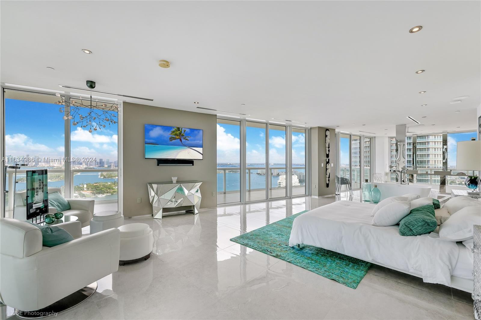 450 Alton Road, Unit PH1 Miami Beach, FL 33139 - Photo 19 of 50 a living room with furniture and a large window