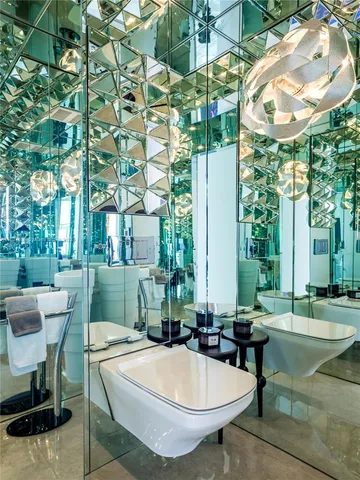 a view of a swimming pool with outdoor seating and plants