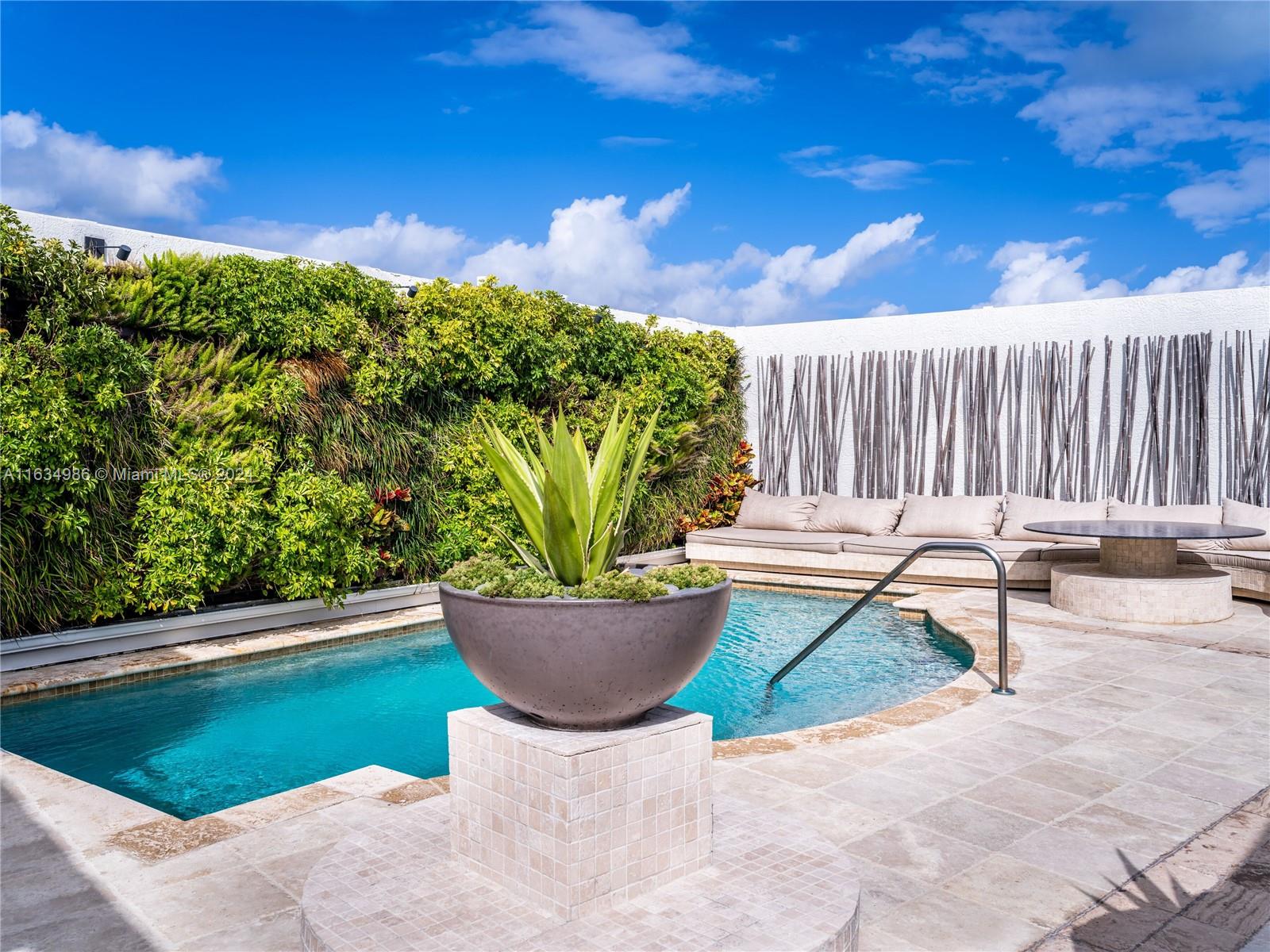 450 Alton Road, Unit PH1 Miami Beach, FL 33139 - Photo 26 of 50 a view of a backyard with sitting area