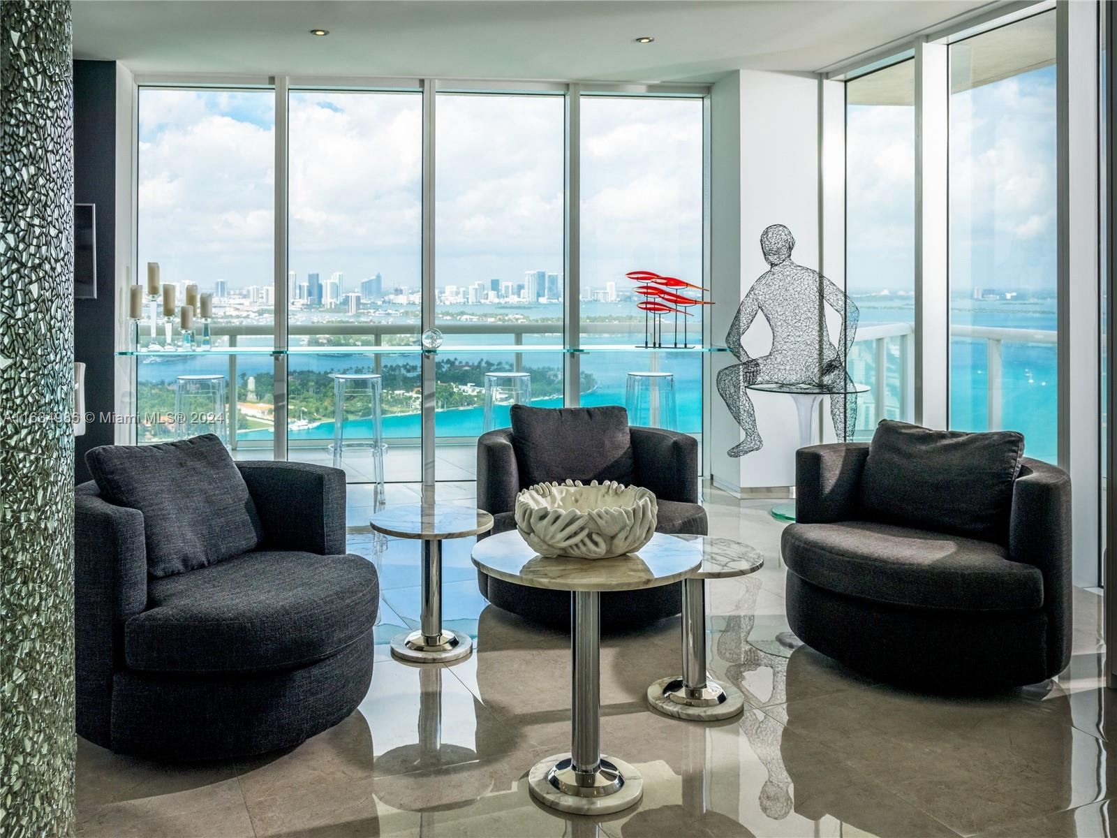 450 Alton Road, Unit PH1 Miami Beach, FL 33139 - Photo 28 of 50 a living room with furniture and a large window