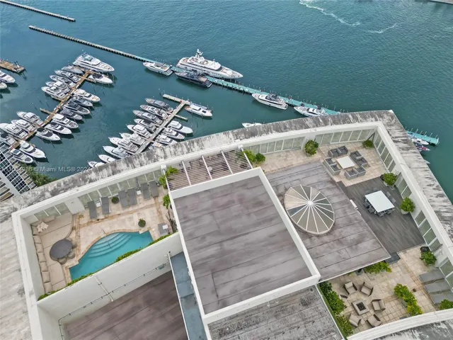 an aerial view of a dining room with furniture