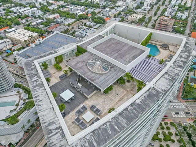 an aerial view of a house with a garden