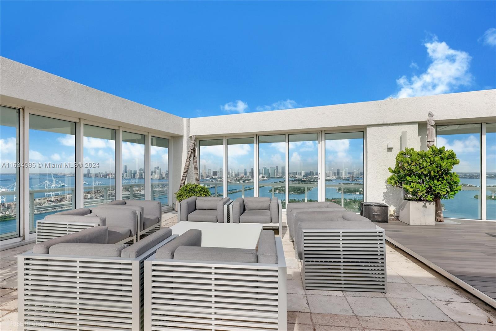 450 Alton Road, Unit PH1 Miami Beach, FL 33139 - Photo 34 of 50 a living room with furniture and a large window