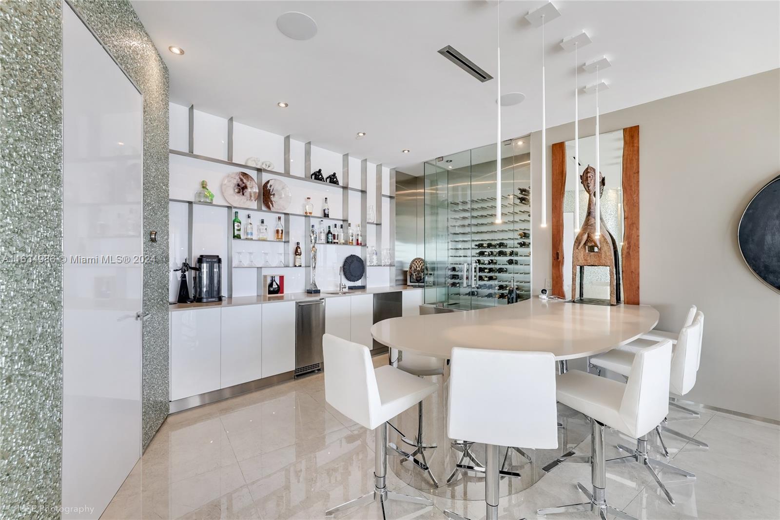 450 Alton Road, Unit PH1 Miami Beach, FL 33139 - Photo 44 of 50 a dining room with furniture and window