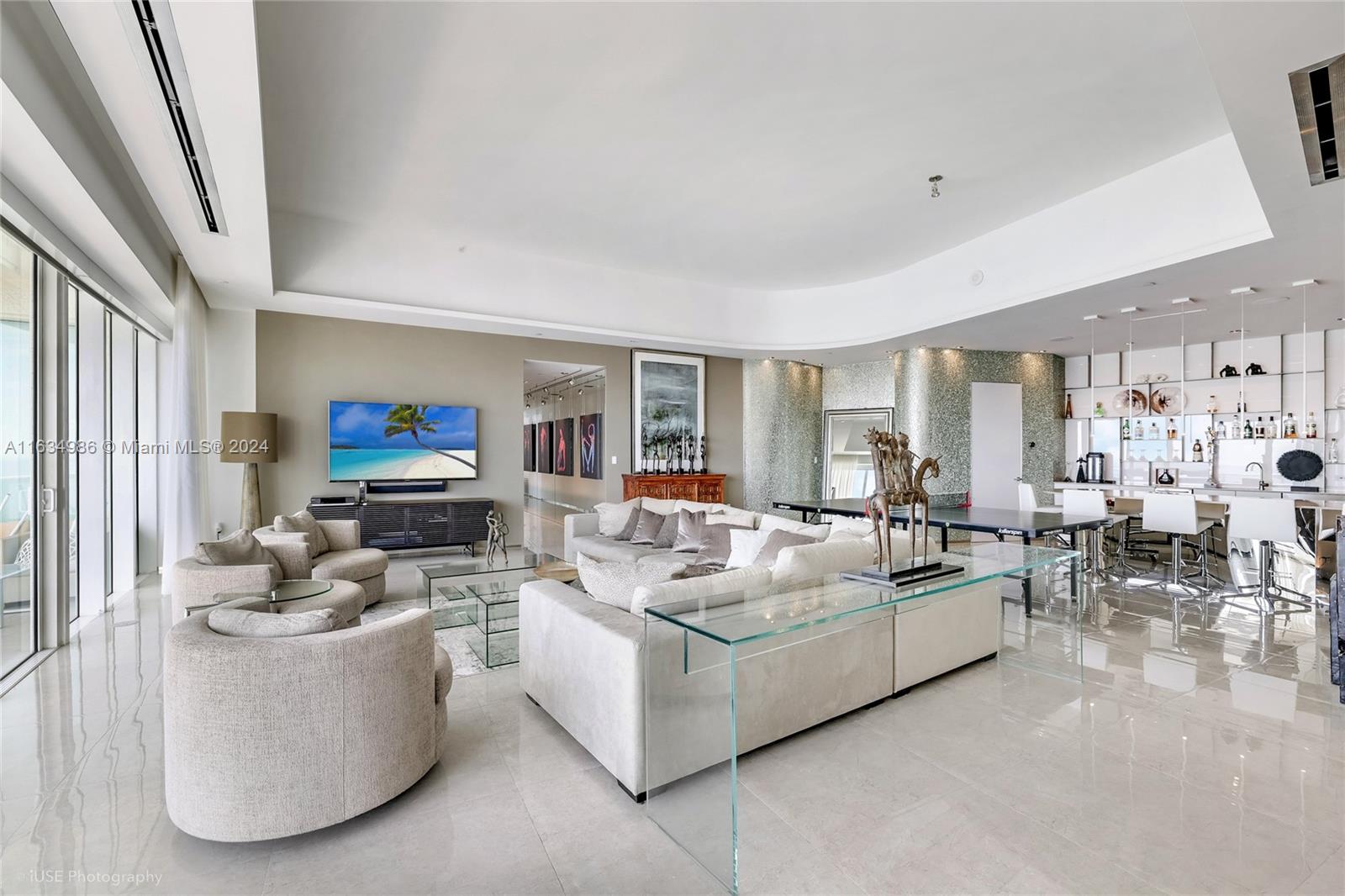 450 Alton Road, Unit PH1 Miami Beach, FL 33139 - Photo 46 of 50 a living room with furniture and a flat screen tv