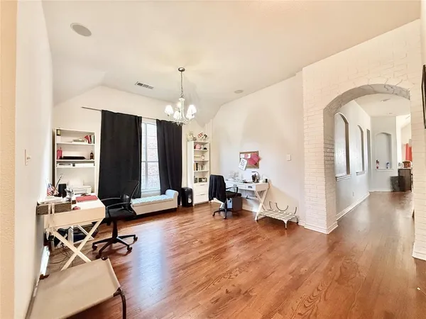 a view of a livingroom with furniture and a flat screen tv