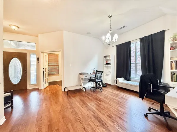 a view of a livingroom with furniture and a window