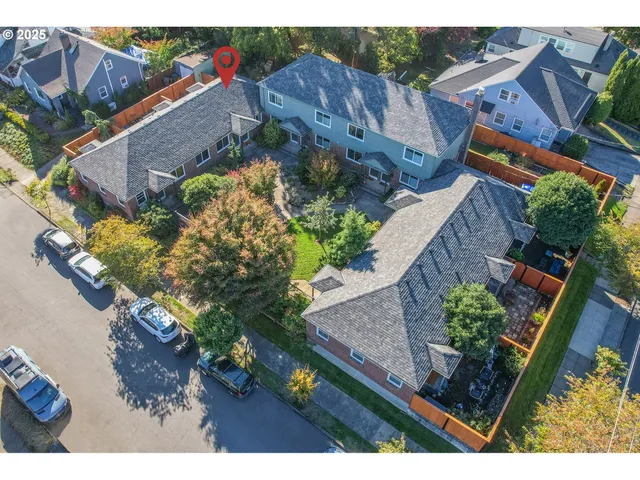 an aerial view of houses with outdoor space