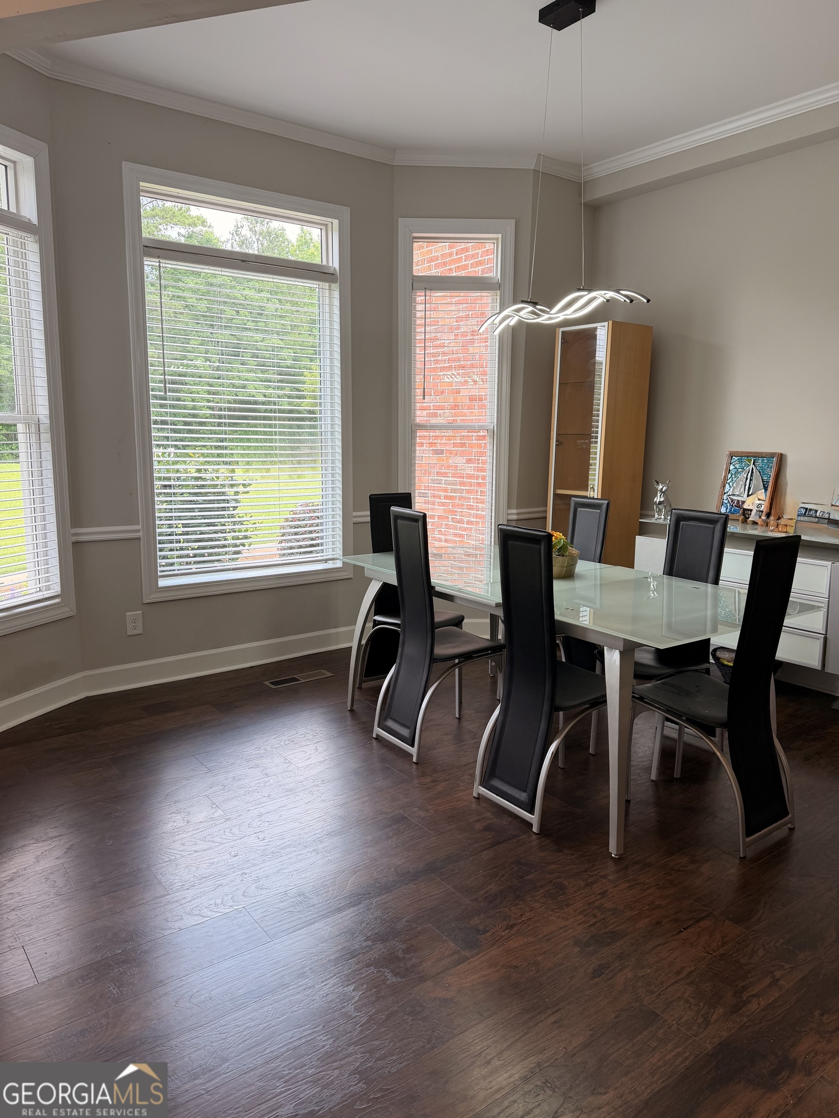 892 Perimeter Road Monticello, GA 31064 - Photo 5 of 38 a workspace with furniture window and wooden floor
