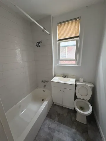 a bathroom with a sink toilet and bathtub