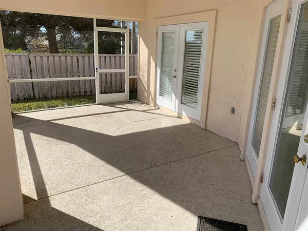 a view of a house with a backyard and a tub