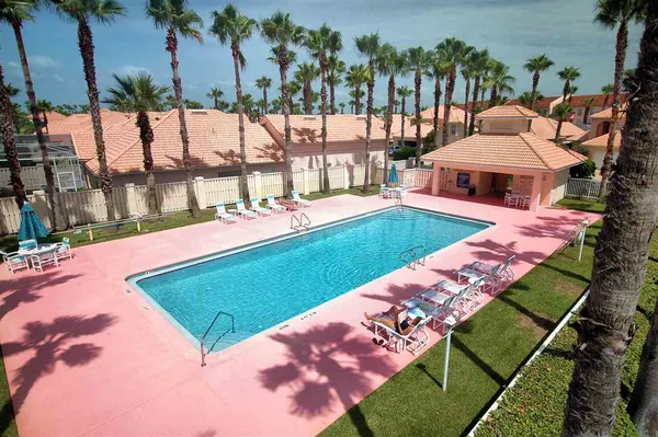 a view of a backyard with swimming pool