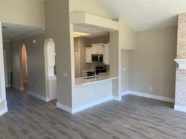 a view of a kitchen cabinets and wooden floor