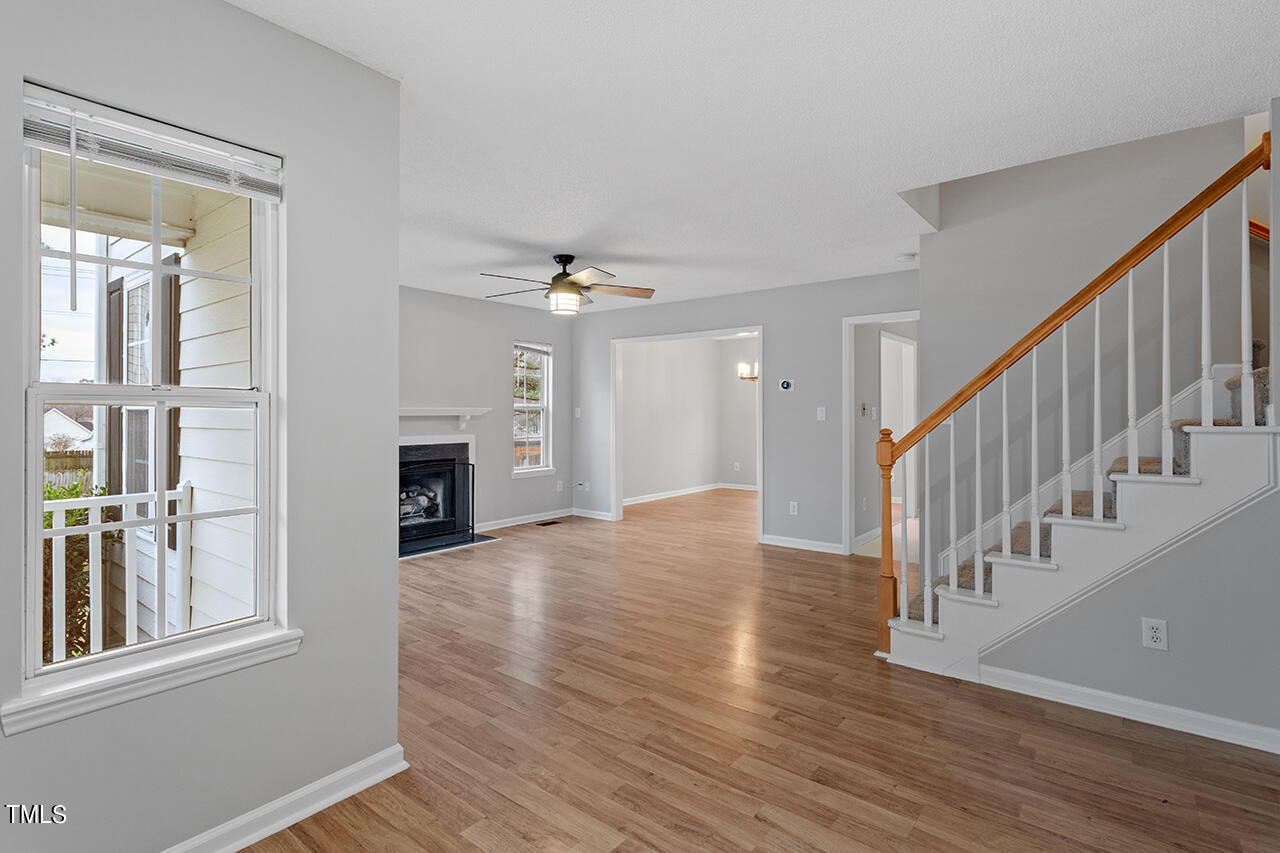 4101 Mardela Spring Drive Raleigh, NC 27616 - Photo 2 of 36 a view of a hallway with wooden floor and staircase