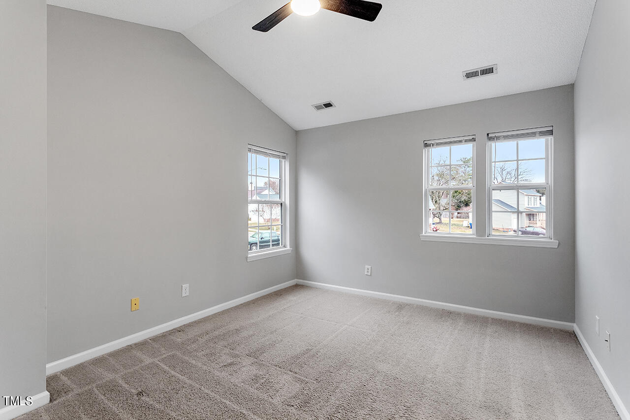 4101 Mardela Spring Drive Raleigh, NC 27616 - Photo 24 of 36 an empty room with windows and fan