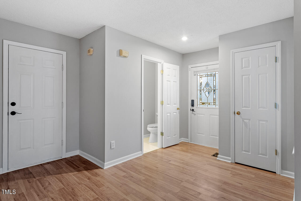 4101 Mardela Spring Drive Raleigh, NC 27616 - Photo 4 of 36 a view of hallway with wooden floor