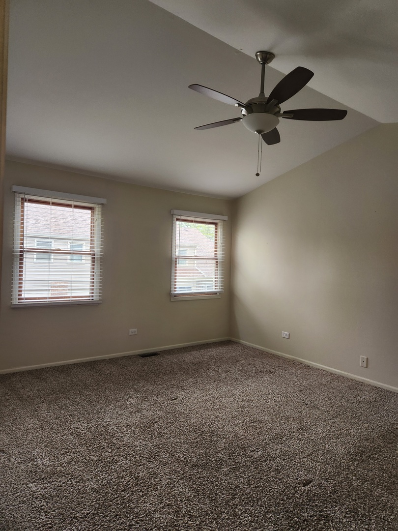15511 Westminster Drive Orland Park, IL 60462 - Photo 9 of 16 an empty room with a empty space and windows