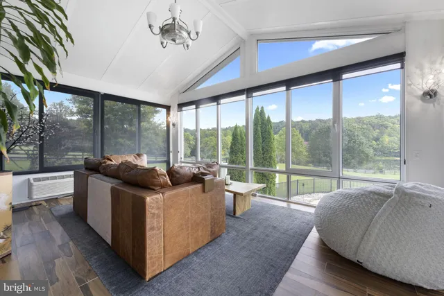 a bathroom with a granite countertop sink a mirror and shower