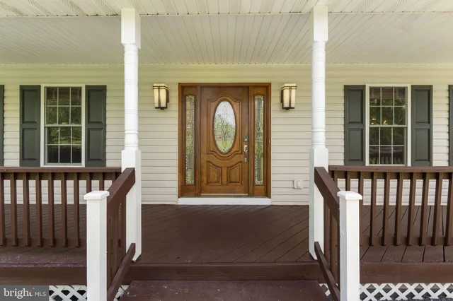 a bathroom with a sink mirror and toilet