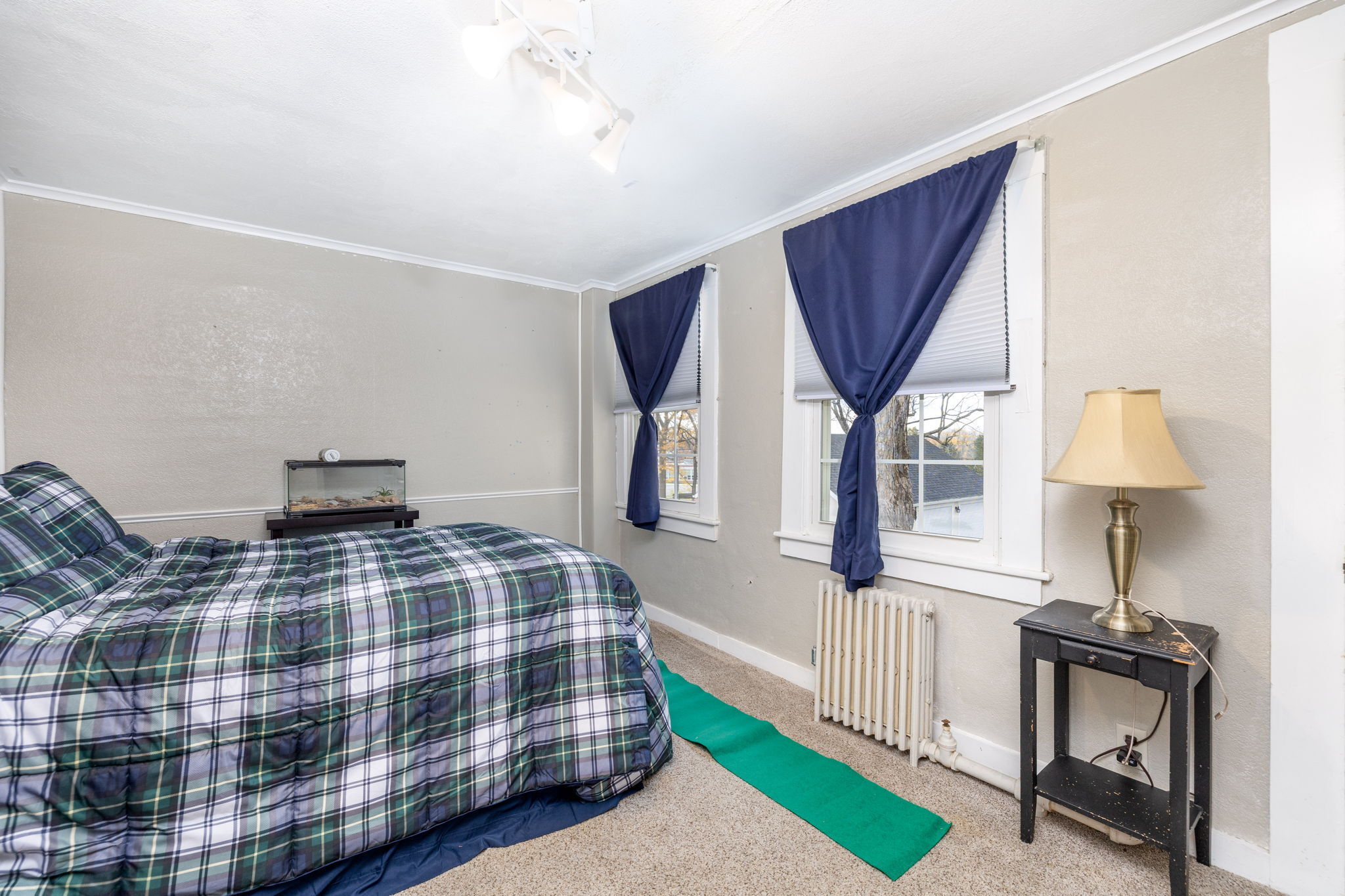 409 Main Street Killingly, CT 06239 - Photo 14 of 39 a bedroom with a bed a mirror and a window