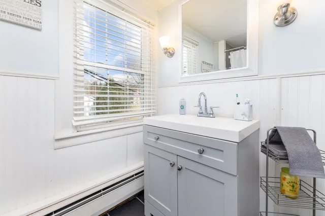 a bathroom with a sink and a window
