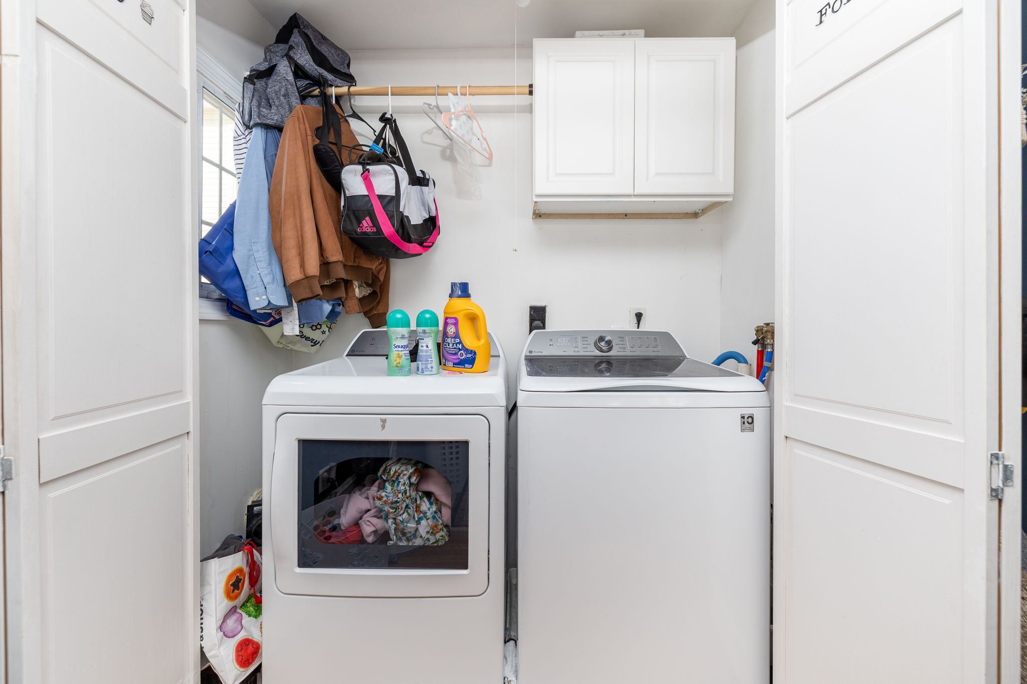 409 Main Street Killingly, CT 06239 - Photo 19 of 39 a view of walk in closet with clothes and shoes