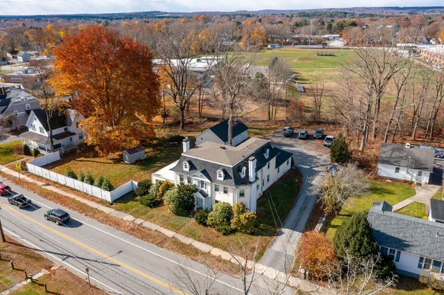 an aerial view of a house with a lake view