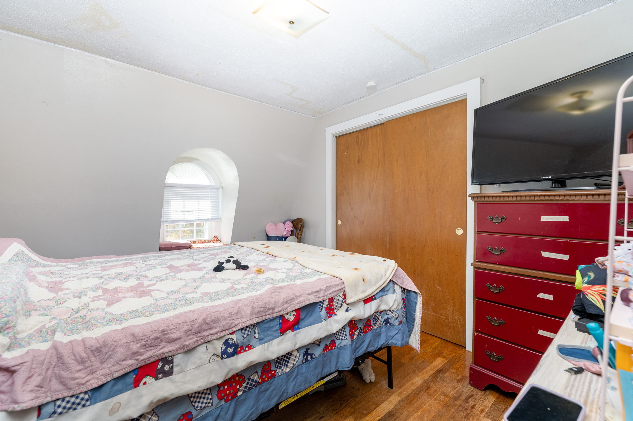 409 Main Street Killingly, CT 06239 - Photo 22 of 39 a bedroom with a bed and a flat screen tv