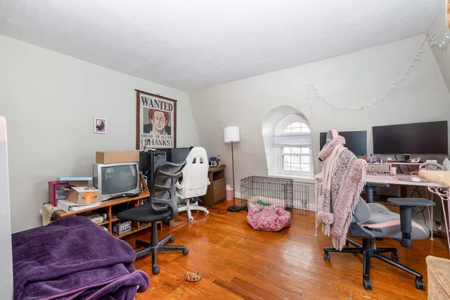 a bedroom with a workspace