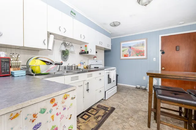 a kitchen with stainless steel appliances and cabinets