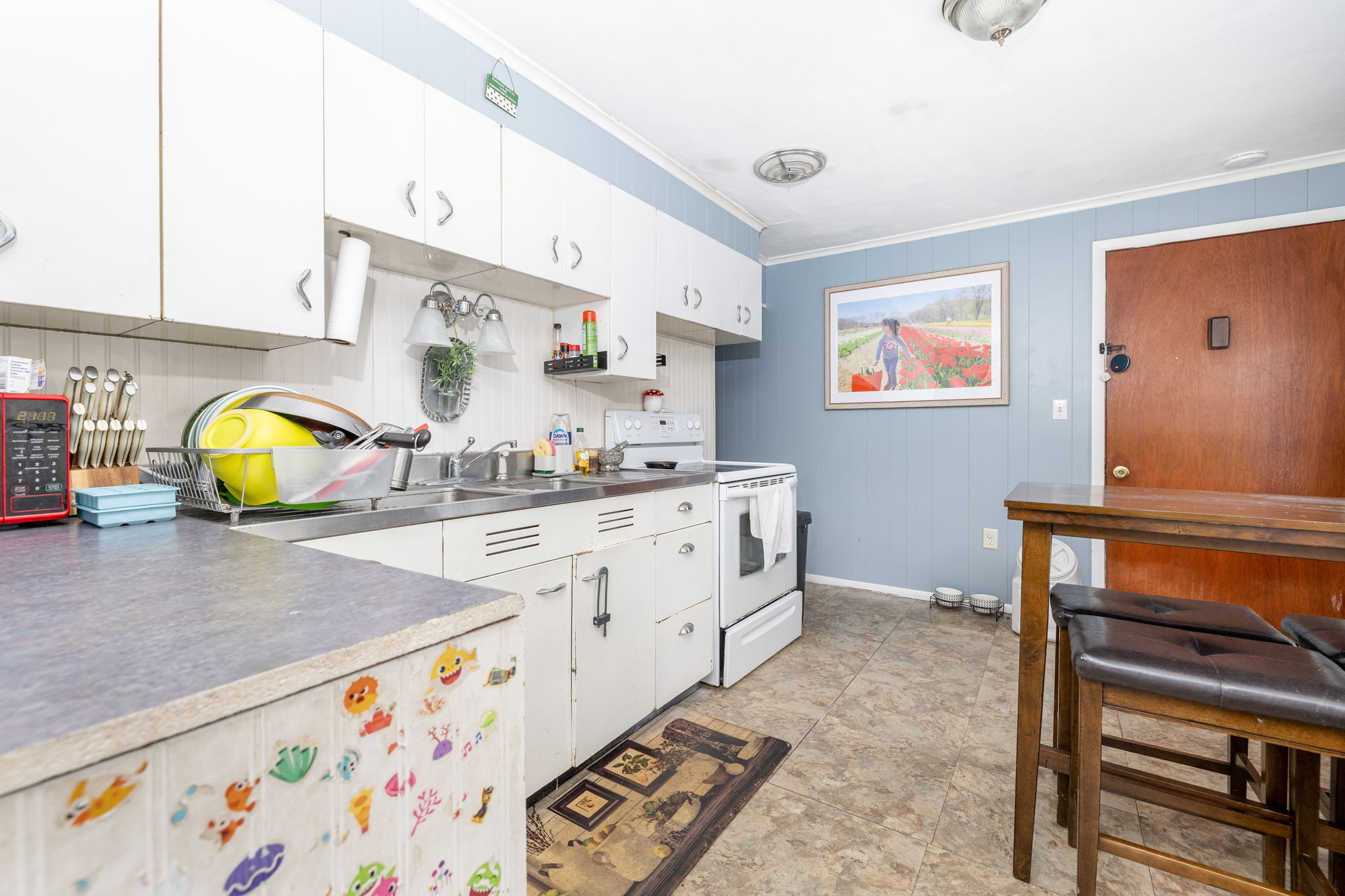 409 Main Street Killingly, CT 06239 - Photo 27 of 39 a kitchen with stainless steel appliances and cabinets