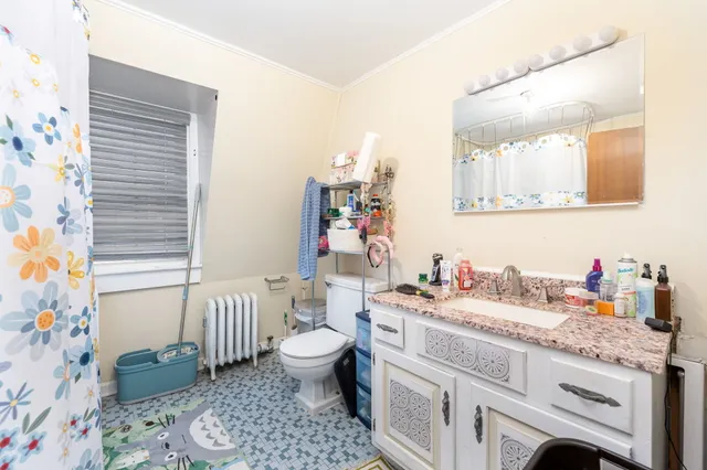a bathroom with a sink toilet and vanity