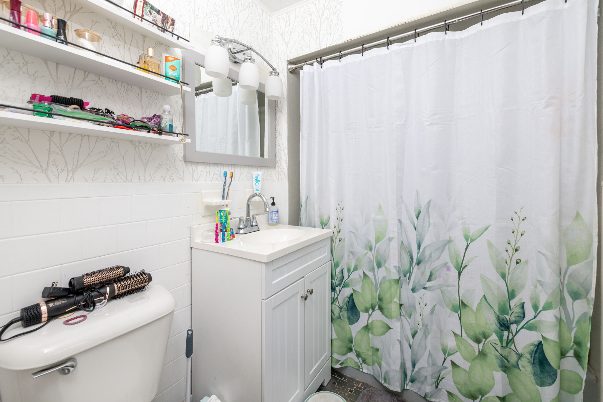 409 Main Street Killingly, CT 06239 - Photo 31 of 39 a utility room with a sink a cabinetry and potted plants