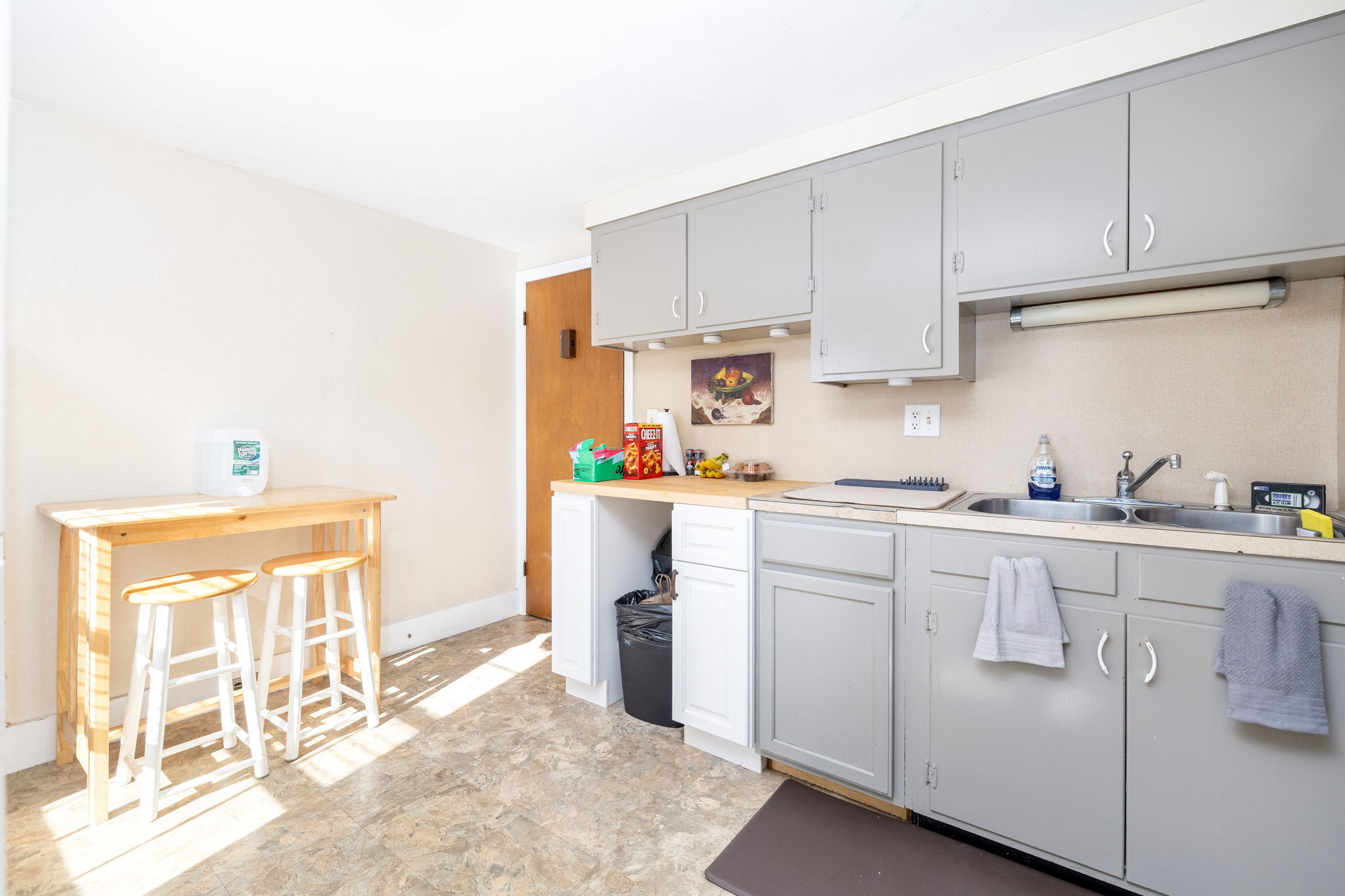409 Main Street Killingly, CT 06239 - Photo 9 of 39 a kitchen with white cabinets and white appliances