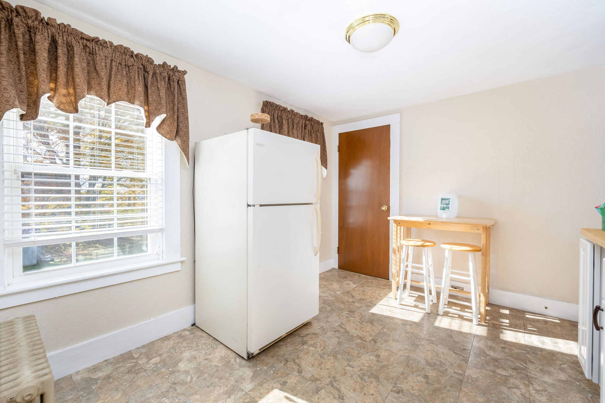 409 Main Street Killingly, CT 06239 - Photo 10 of 39 a view of a livingroom with wooden floor and a window