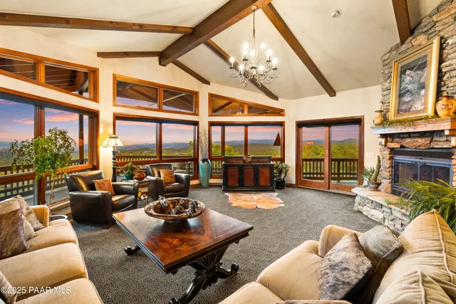 a view of a balcony with furniture and wooden floor