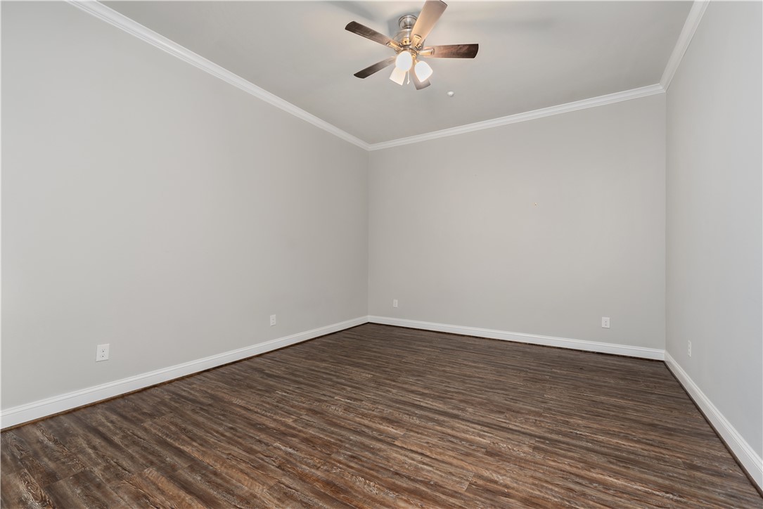 401 North Main Street, Unit 206 Bryan, TX 77803 - Photo 11 of 20 a view of an empty room with wooden floor