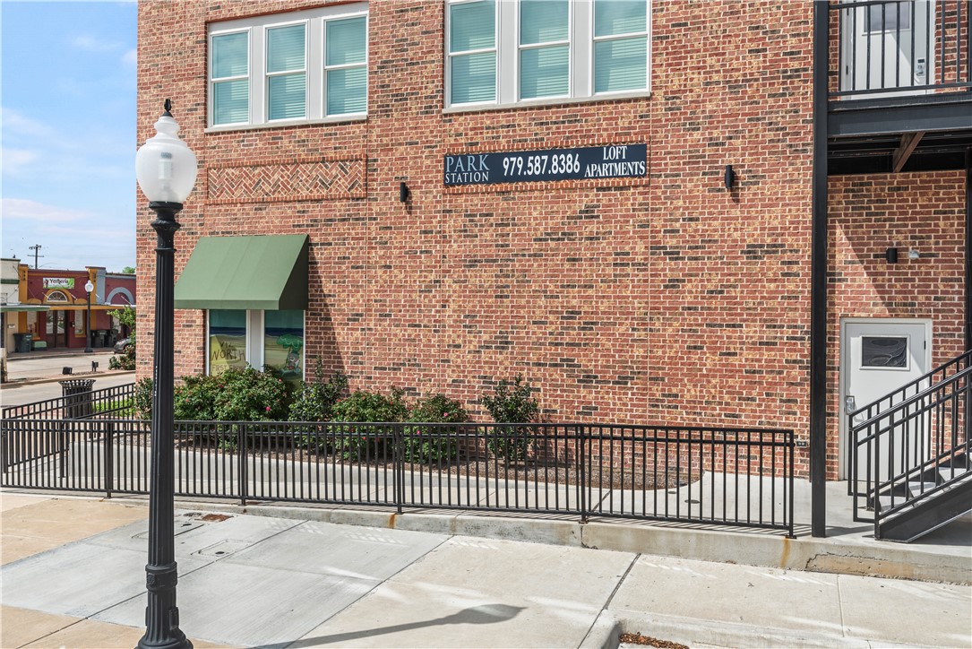 401 North Main Street, Unit 206 Bryan, TX 77803 - Photo 5 of 20 a brick building with a street