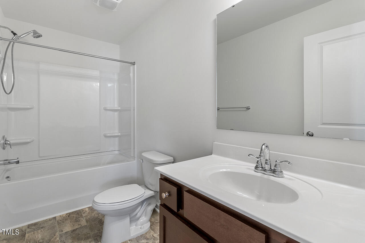 147 Pineapple Place Benson, NC 27504 - Photo 15 of 20 a bathroom with a sink toilet vanity and shower